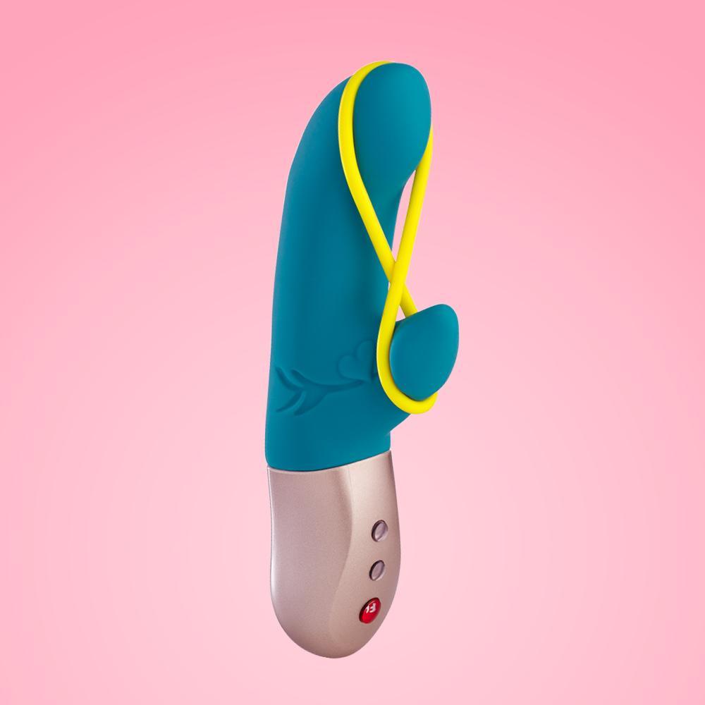 Amorino rabbit vibrator with yellow clitoral stimulation band on pink background