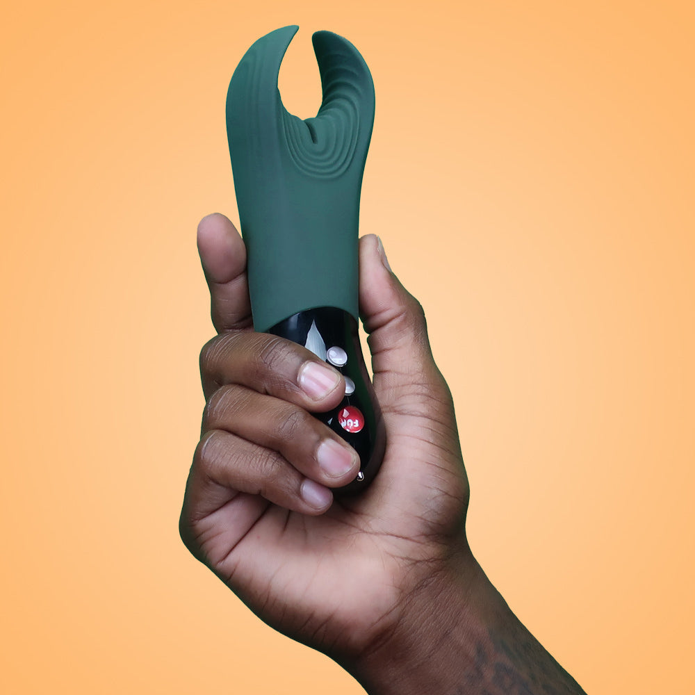 Fun Factory's Manta vibrator being held in a man's hand