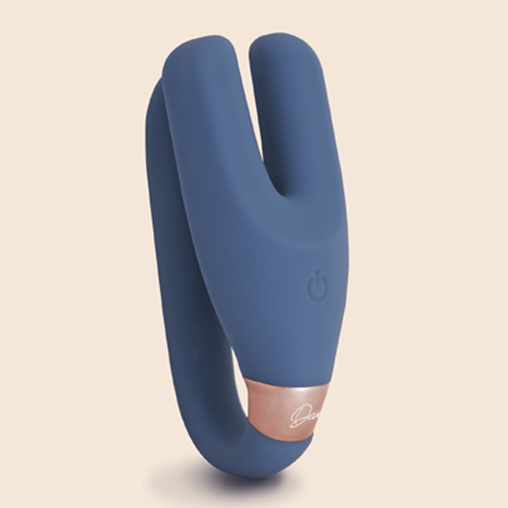 Deia - the Wearable vibrator with remote shown on tan background - Periwinkle blue color