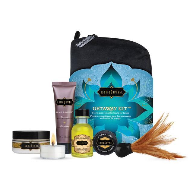 Kama Sutra Get-Away-Kit shown out of box-honey dust-love oil- candle-dusting feather-body creme and get a way package