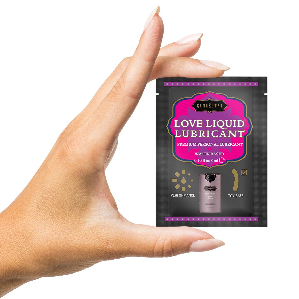 hand holding packette of Kama Sutra's Love Lubricant