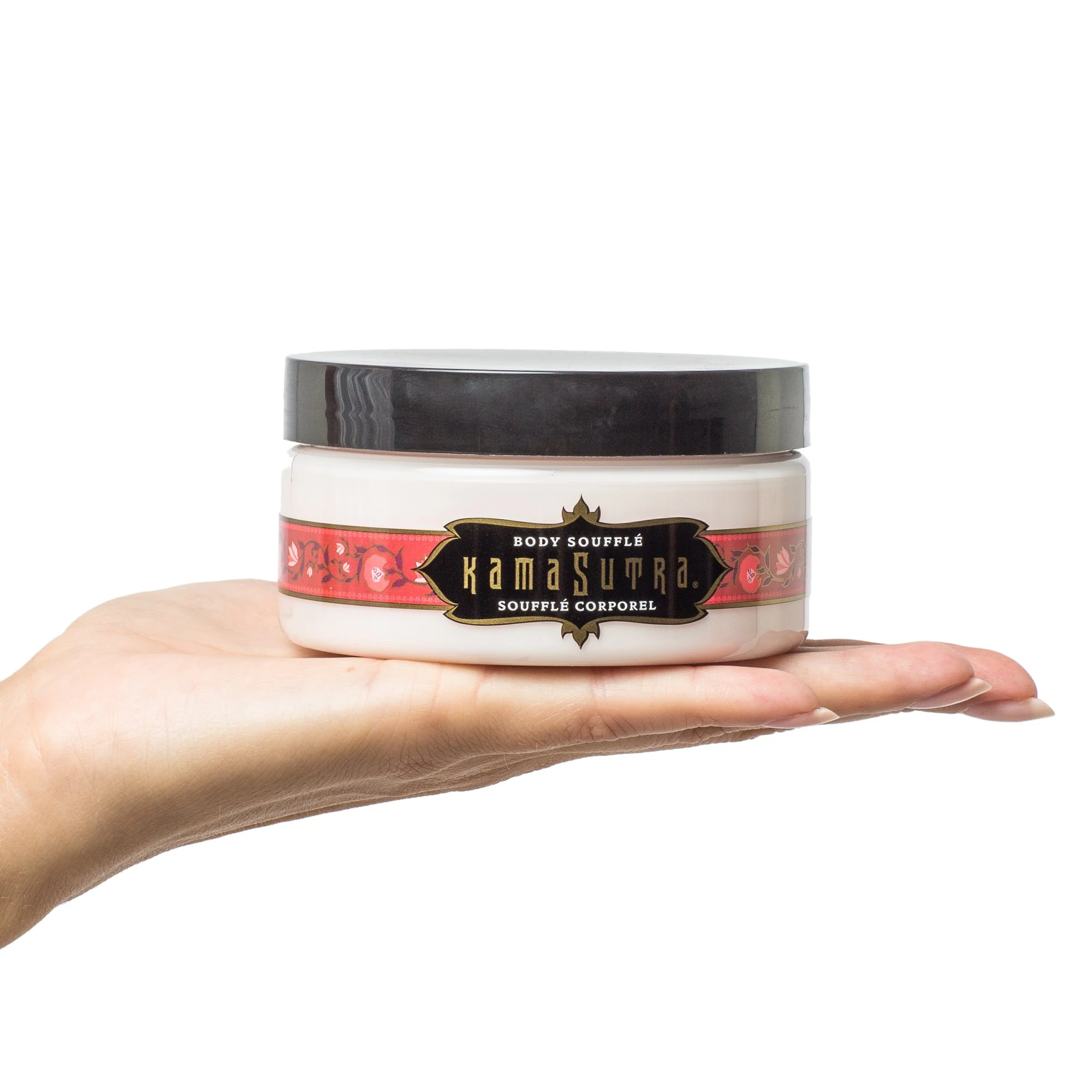 Kama Sutra's Body Souffle-moisturizing creme shown being held by female hand